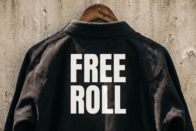 FREE ROLL heat-pressed in white vinyl on the back of a black gi